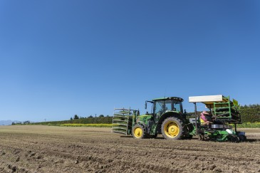 jay clarke DAP3233 credit dave allen Tractor in a ploughed paddock with a planting unit on the back planting leeks